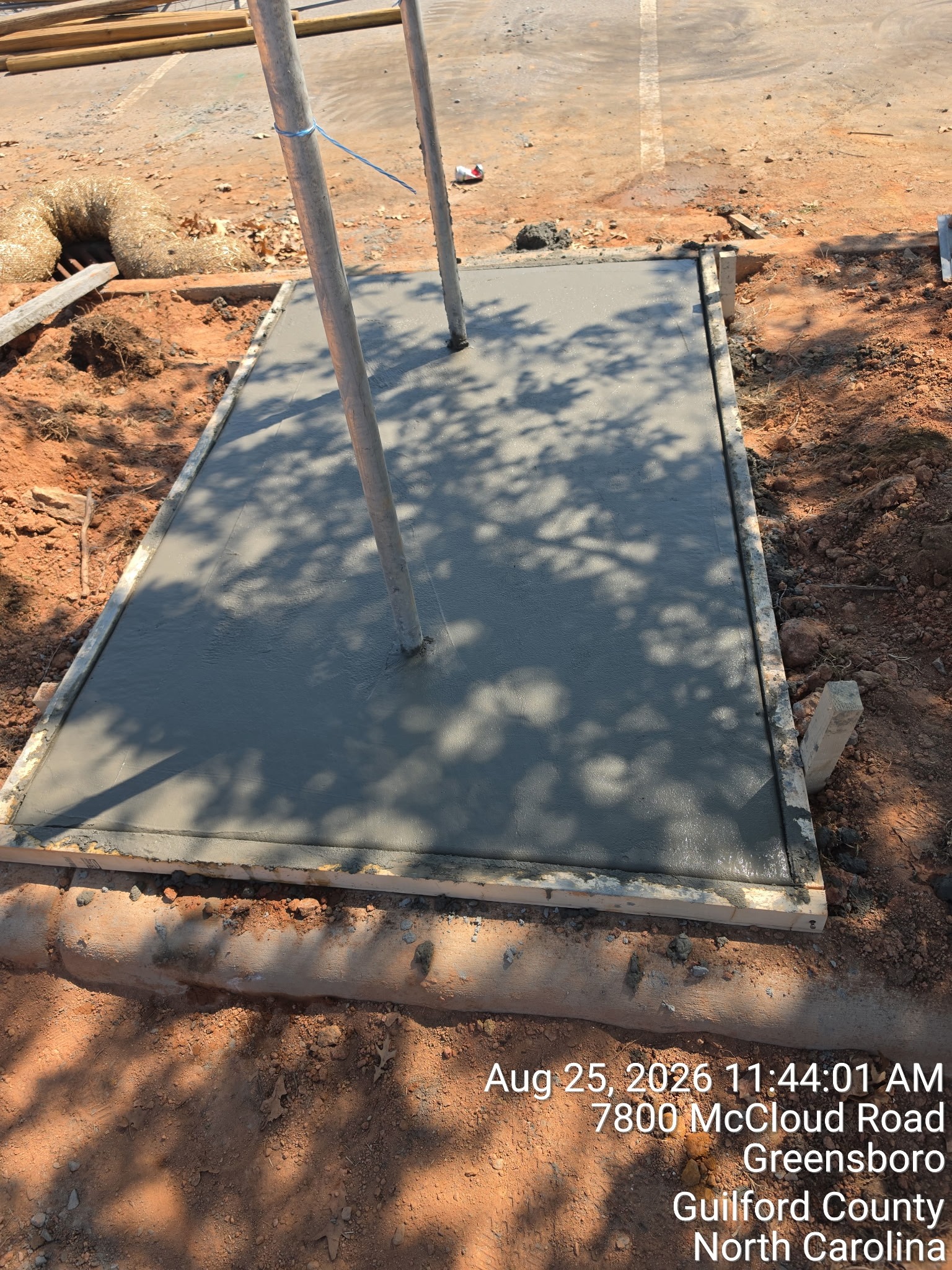 Completed concrete equipment foundation with electrical conduit stub-ups